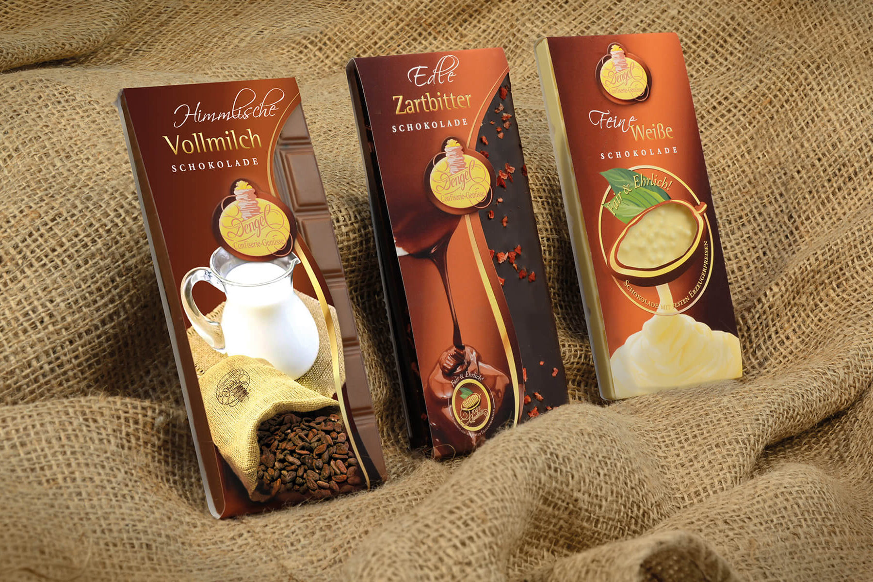 Tafelbanderolen + Verpackungen. Konzept, Gestaltung, Collagen, Stanzvorlagen, Druck.